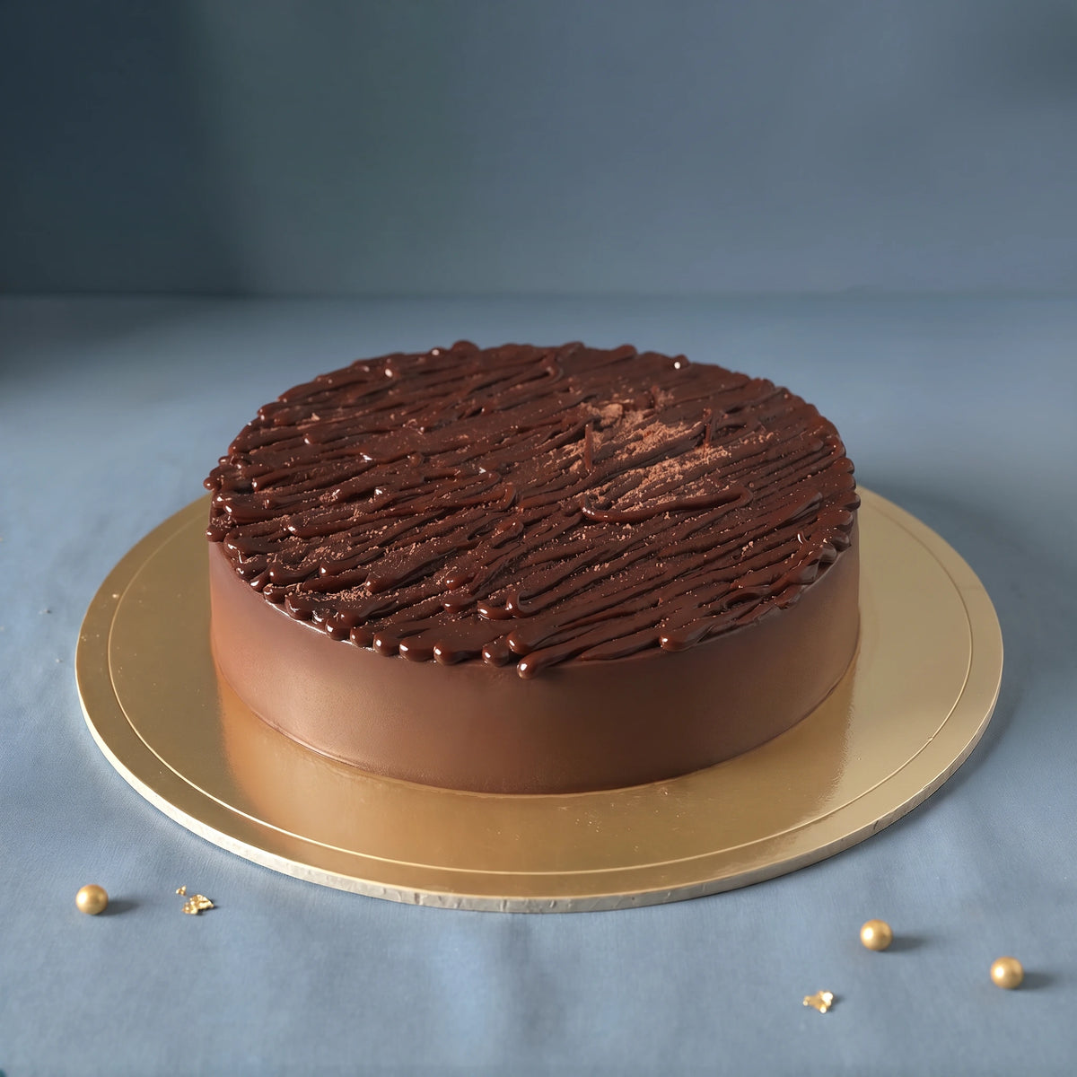 Belgian Chocolate Truffle Cake handcrafted with rich Belgian chocolate by PuffyClouds Cakes in Kakkanad, Kochi.
