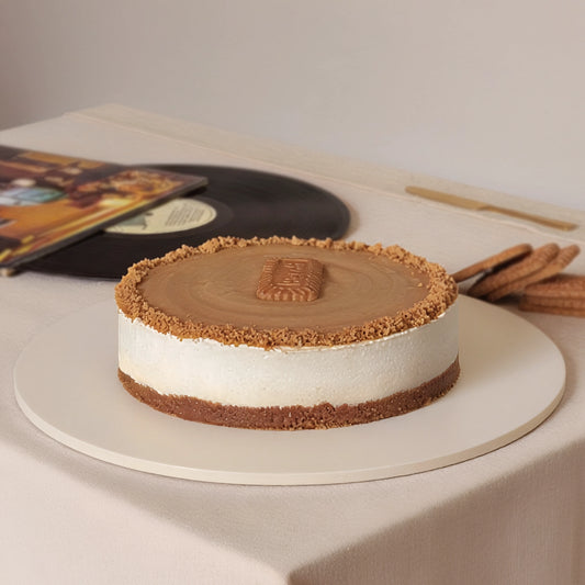Creamy Lotus Biscoff cheesecake with a buttery biscuit base, silky Biscoff topping, and biscuit crumb by PuffyClouds, Kakkanad, Kochi